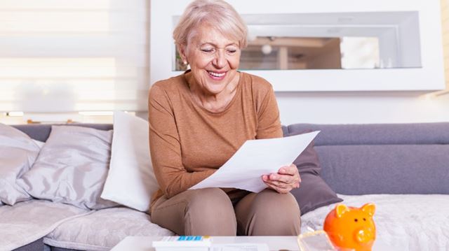 How to save money by switching energy providers old woman looking at paper